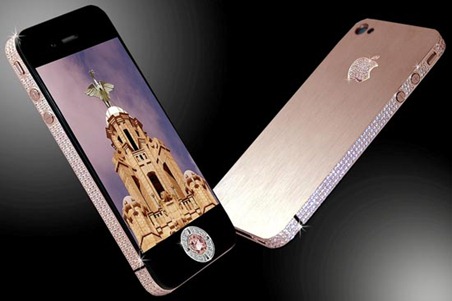 The most expensive phone in the world a custom upgraded iPhone 4 worth £5million. See SWNS story SWPHONE: This incredible bedazzled iPhone 4 was unveiled as the world's most expensive phone - worth an eye-watering £5 MILLION. British designer Stuart Hughes, 38, will only make two of the handmade rose gold models which feature more than 500 individual flawless cut diamonds, totaling 100ct. Each dazzling handset comes complete with two rare diamonds which were sourced from Australia and are worth over £4 million together. The backs of the phones also glitter with 53 diamonds surrounding the Apple logo, which is rose gold. Dad-of-two Stuart, from Liverpool, was commissioned to make the phones - which took two months to make - by a wealthy Australian businessman.