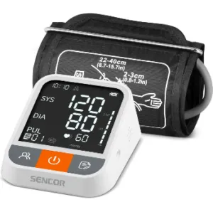 The image shows a SENCOR blood pressure monitor with a cuff and a digital display showing systolic and diastolic readings.Obsah generovaný pomocí AI může být nesprávný.